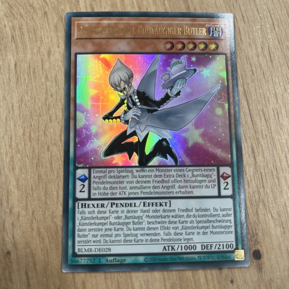 Yu-Gi-Oh! Künstlerkumpel Buntäugiger Butler Ultra Rare 1. Auflage BLMR-DE028 NM - Bild 1 von 2