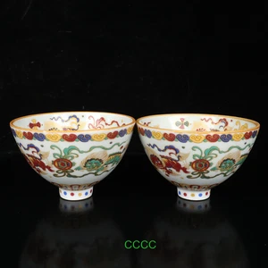 Exquisita porcelana antigua china un par de coloridas tazas estampadas de dos leones - Imagen 1 de 7