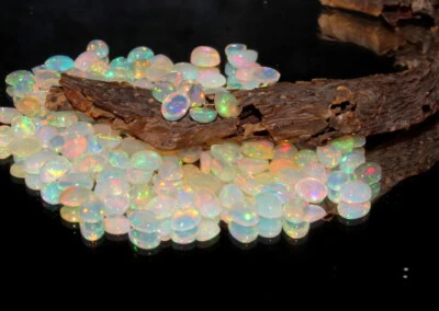 AAA Natural Etíope Welo Ópalo de Fuego Cabujón Ópalo Ovalado Piedra Preciosa Suelta 7x5mm Foto 1 de 4