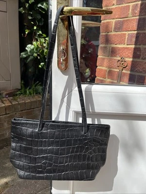 Bolso Osprey cuero negro en muy buena condición Foto 1 de 4