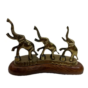 Scultura vintage in ottone di 3 elefanti montati su base in legno, made in India - Foto 1 di 8