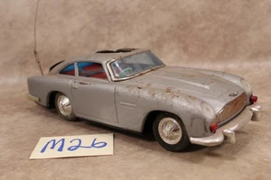 M26B Vintage Ist-Zustand Spielzeugauto FOR PARTS GILBERT ASTON MARTIN JAMES BOND AUTOBATTERIE - Bild 1 von 1