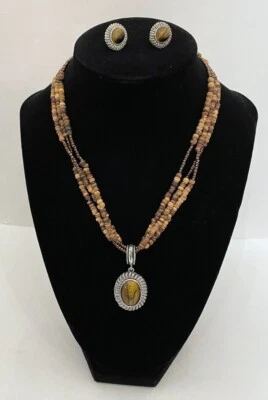 Juego de pendientes con clip de cuentas naturales de colección Avon ojo de tigre colgante en múltiples hebras  Foto 1 de 4