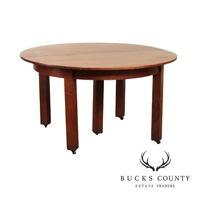 L. & J.G. Mesa de comedor redonda antigua Stickley de roble Foto 1 de 4