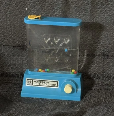 TOMY WATERFUL TIC 1976 DE COLECCIÓN, TAC, TOE JUGUETE ACUÁTICO-FUNCIONA Foto 1 de 3
