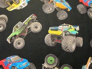 MONSTER TRUCKS IN MOTION BLACK COTTON FABRIC FQ  - Picture 1 of 5