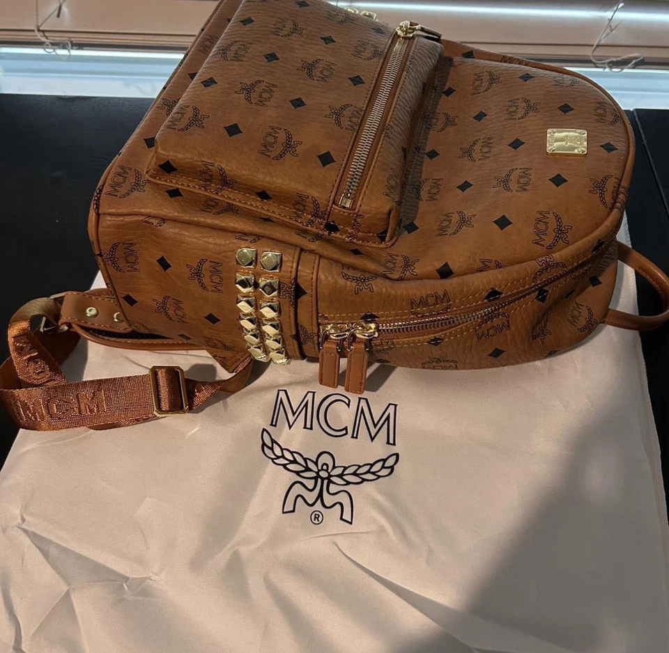 Mochila MCM de cuero negro/marrón talla mediana  Foto 1 de 4