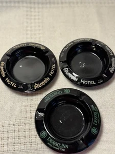 Vtg Las Vegas Black Glass Ashtrays 2 Aladdin Hotel & 1 Desert Inn - Picture 1 of 3