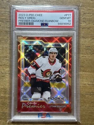2023 O-PEE-CHEE RIDLY GREIG RC PREMIER- DIAMOND RAINBOW/75 #P-77 PSA GEM MINT 10 - Image 1 of 2