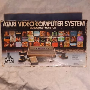 CONSOLA ATARI 2600 CX-2600A ORIGINAL VINTAGE AÑOS 80 CON CAJA E INSERTOS + 7 JUEGOS - Imagen 1 de 13