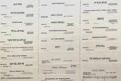 Lot of 26 - Eb Baritone Saxophone Parts for DAVE WOLPE Arrangements - Image 1 of 4