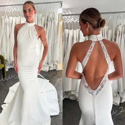 Vestidos de novia de satén de sirena sexy con cuello halter y cola de barrido sin espalda Foto 1 de 4