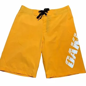 Oakley Mens Size 34 Board Shorts Swim Suit Trunks Spellout Orange Yellow - Picture 1 of 8