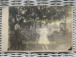 Early 1900s RPPC Girl In Yard with Buggy & Man - Picture 1 of 2