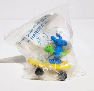 Peyo Applause Hardees Smurfin' Smurfs 1990 monopatín amarillo sellado en plástico  Foto 1 de 2