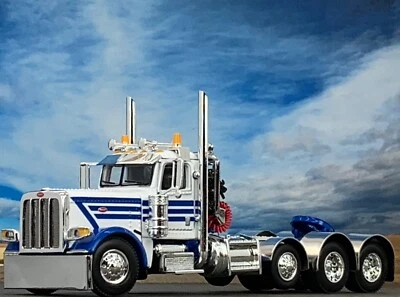 1/64 DCP WHITE/BLUE PETERBILT 389 HEAVY HAUL DAY CAB - Image 1 of 4