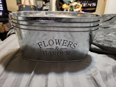 Galvanized Metal Oval Planter With "FLOWERS & GARDEN" Text. - Image 1 of 4