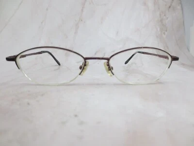 Marco de gafas Nicole Miller para mujer marrón brillante metal ovalado medio borde 51-18-140 Foto 1 de 4