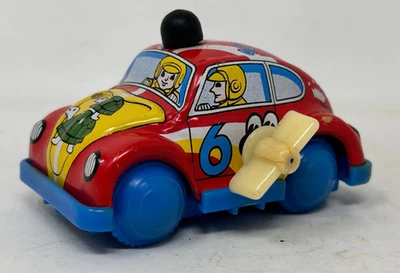 Vintage Japanese Tin And Plastic Wind Up VW Bug Acrobat Team Car - Image 1 of 4