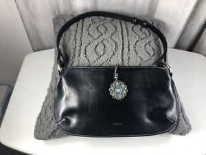 XOXO BLACK Shoulder bag,flat clutch.Silver medallion snap closure with accents. 