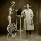 Young girl cat and her skeleton friend 1909 vintage old 8x10 Photo