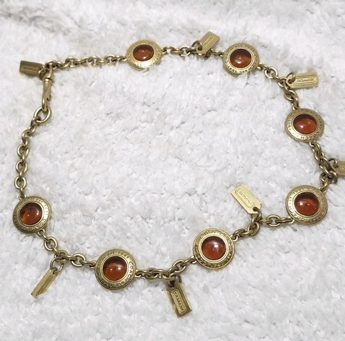 Collana Coach in pensione rara edizione limitata Snaphead tono oro ambra