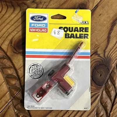 1/64 Ertl NEW HOLLAND SQUARE BALER NIP - Image 1 of 3