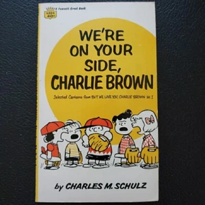 Peanuts Paperback book “We’re On Your Side Charlie Brown ” by Charles M Schulz - Imagen 1 de 7