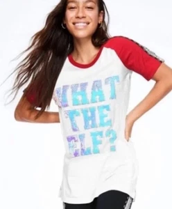 Neu mit Etikett Damengröße Large "What The Elf?" Glitzer Victoria's Secret rosa Shirt - Bild 1 von 2