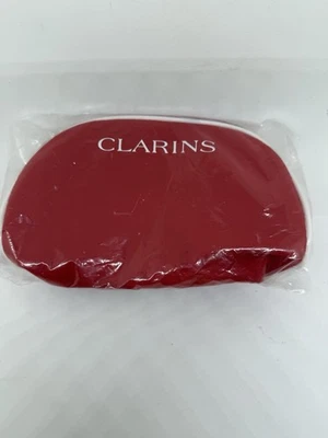 Bolsa de viaje de maquillaje cosmético Clarins roja con ribete blanco - cierre de cremallera Foto 1 de 4