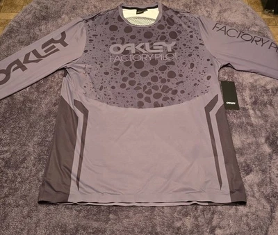 CAMISETA OAKLEY HOMBRE PIEL DE RANA RC LS TALLA L NEGRA RANA 9TA NUEVA CON ETIQUETAS CICLISMO  Foto 1 de 4