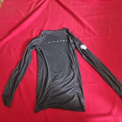 Rip Curl wet suits Gr.xs UPF 50+ Perf. Langarm Shirt / body  anthrazit  - Bild 1 von 4