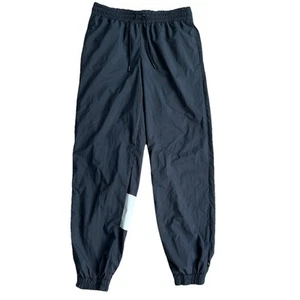 Pantalones de chándal Nike Logo cortavientos negros para mujer talla pequeña nuevos con etiquetas - Imagen 1 de 10