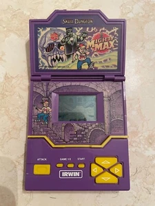 SystemA Mighty Max Skull Dungeon LCD Game - Working - Foto 1 di 4