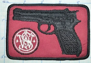 PARCHE PUBLICITARIO CON LOGOTIPO VINTAGE PISTOLA DE FUEGO SMITH & WESSON - Imagen 1 de 2