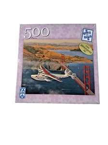 NEW Schmid  500 Pc Jigsaw Puzzle AIRPLANE FLYING OVER SAN FRANCISCO BRIDGE - Picture 1 of 7