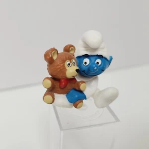 Pitufo bebé pitufo con peluche cerca de figura (1984) Peyo Schleich - Imagen 1 de 12