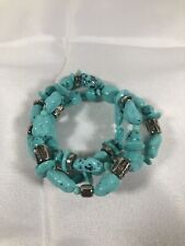 Turquoise colored bracelet w/ silver plated spacers. OSFM. Preowned.