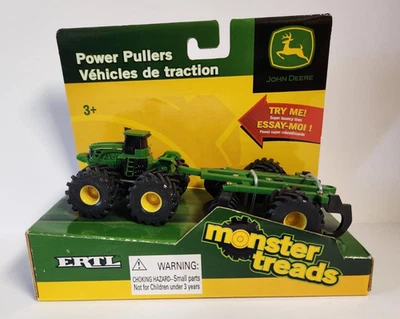 Tractor Ertl John Deere Monster Treads 37606 con remolque escala 1:64 plástico Foto 1 de 4