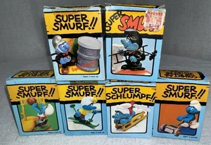Vintage Super Schlümpfe Posten PVC Figur 6er Set in Box Feuerwehrmann Volleyballmäher - Bild 1 von 15