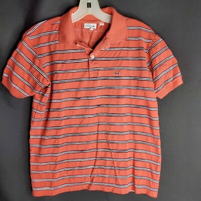 Camisa Polo Lacoste Niños 16 CORAL con Tenis a Rayas Negras/Blanco Informal Foto 1 de 4