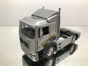 NEW-RAY MAN 19.604 FLS TRUCK TRACTOR -SILVER METALLIC 1:32- GOOD - Imagen 1 de 6