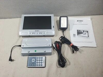 Jensen 7" TFT LCD Color TV w Dock Remote & Manual. JTFT-700 - Image 1 of 4