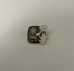 Pasador de colección de los Juegos Olímpicos de Calgary 1988 esmalte mascota aullador solapa corbata sombrero - Imagen 1 de 2
