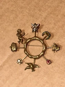Vtg. Goldette Unsigned Pinwheel Brooch Cherub Bird Lion Heart Flower Bee Crown - Picture 1 of 6