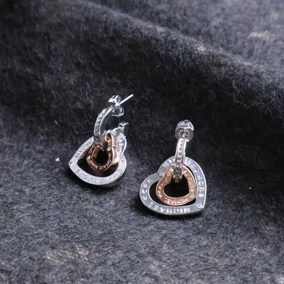 Pendientes de corazón Michael Kors entrelazados de plata y oro rosa Foto 1 de 2