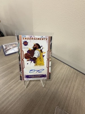 Motivo Topps 2023-24 - Endosos Autógrafos D'Angelo Russell Naranja/25 Foto 1 de 4