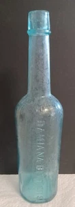 Botella Damiana Bitters Baja aprox. Top aplicado hombro Lewis Hess estrella en bot - Imagen 1 de 10