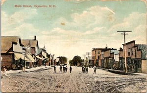 Reynolds North Dakota ND Main Street Men Store Fronts RPPC c1910s Postcard A99 - Picture 1 of 2