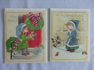 2 Grußkarten "Weihnachtskinder" 1984: Junge mit Welpe/Mädchen spielt Flöte - Bild 1 von 3